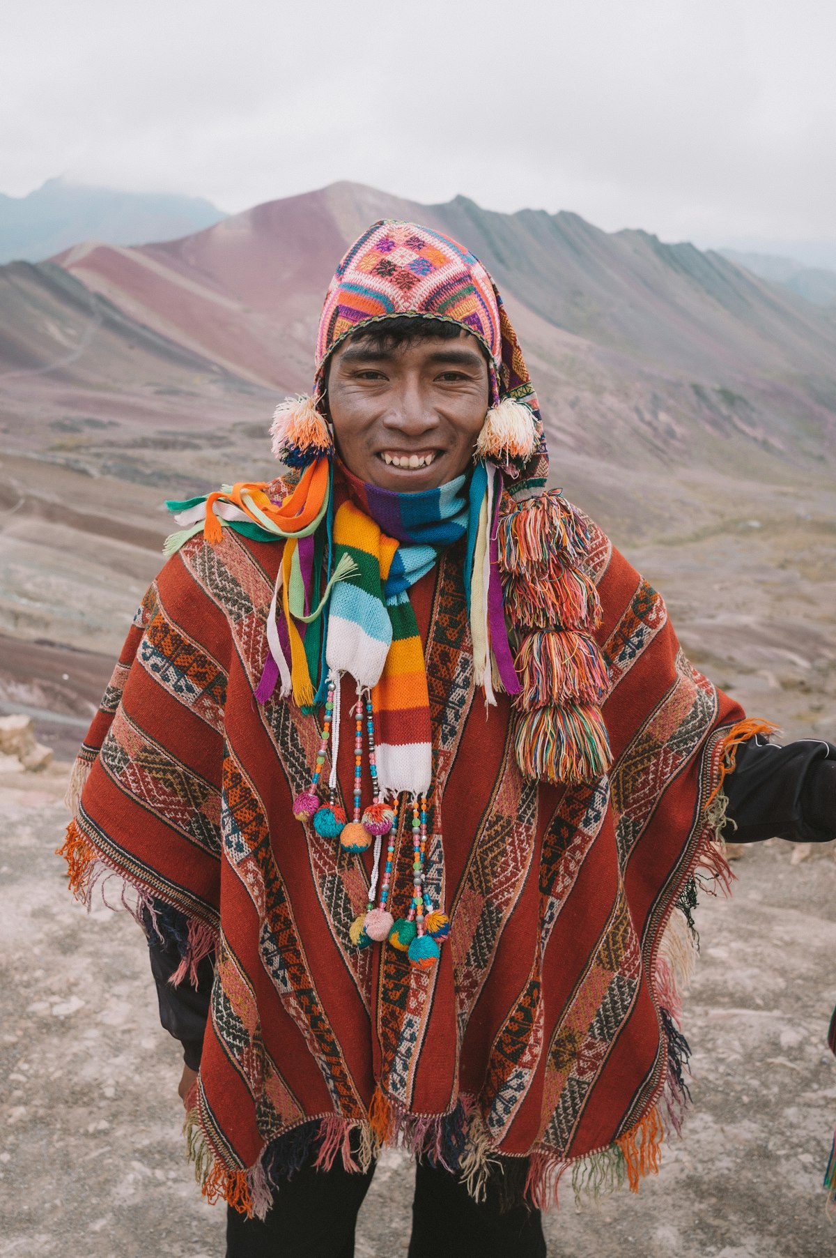 Local man in traditional Andean poncho in the Cusco region, Peru